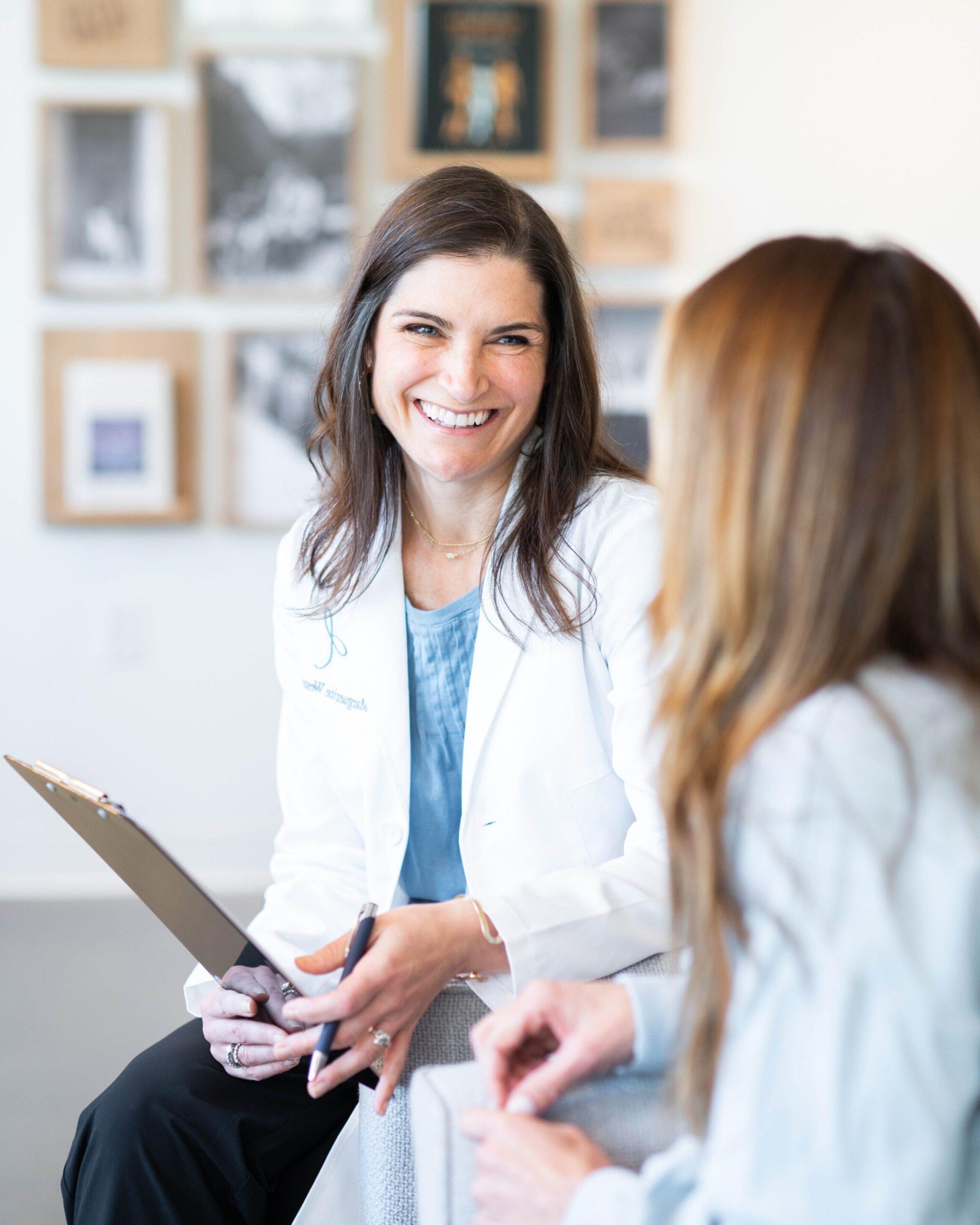 Dr. Marguerite Weston with a functional medicine patient